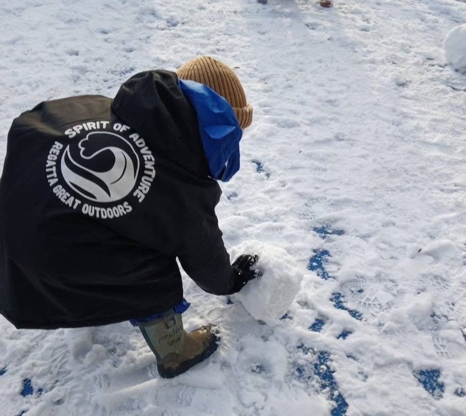 A child enjoying outdoor snow play